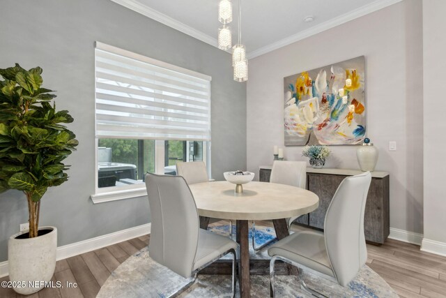 95158 Sandy Pointe Dr, Fernandina Beach, FL 32034 - dining room with wood finished floors and crown molding