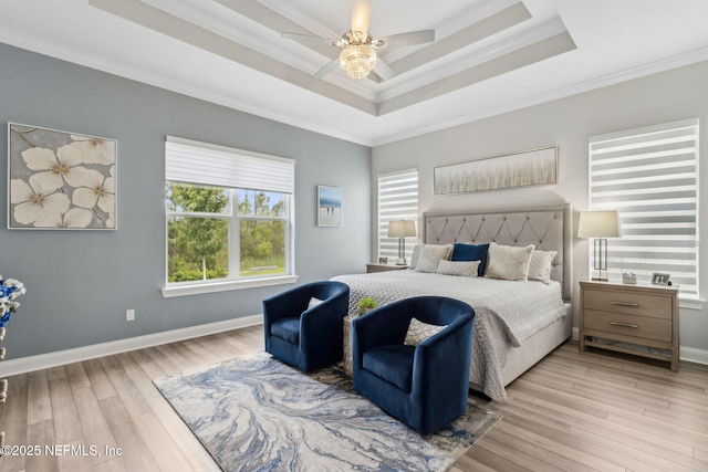 95158 Sandy Pointe Dr, Fernandina Beach, FL 32034 - bedroom featuring multiple windows, a raised ceiling, wood finished floors, crown molding, and ceiling fan