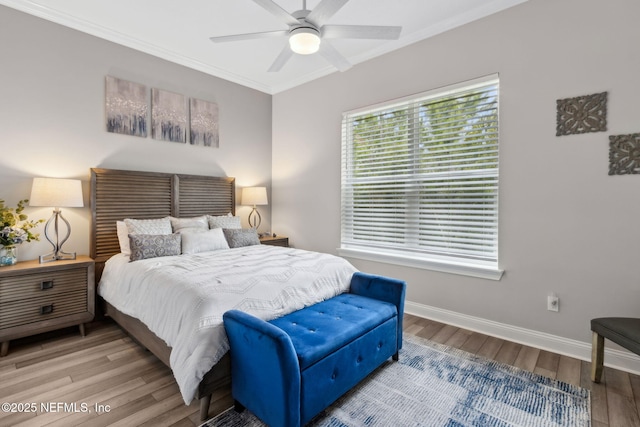 95158 Sandy Pointe Dr, Fernandina Beach, FL 32034 - bedroom with wood finished floors, crown molding, and a ceiling fan