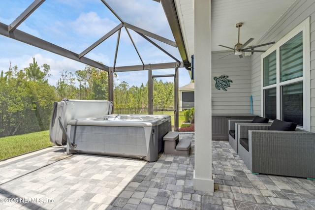 95158 Sandy Pointe Dr, Fernandina Beach, FL 32034 - view of patio / terrace featuring a hot tub, ceiling fan, and glass enclosure