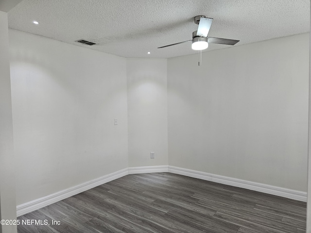 1203 Stern Way, Fleming Island, FL 32003 - empty room with dark wood-type flooring, a textured ceiling, a ceiling fan, recessed lighting, and baseboards