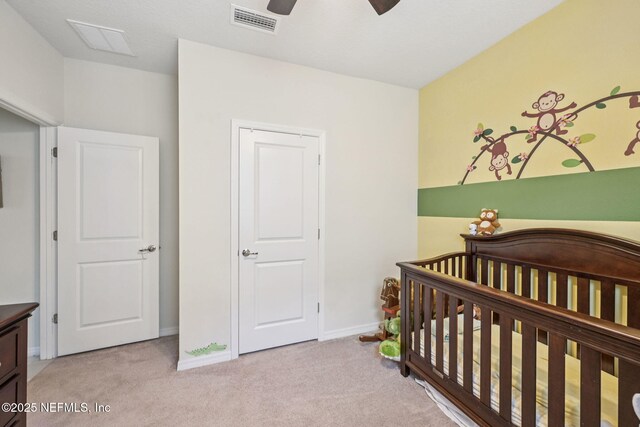 600 Broomsedge Cir, Saint Augustine, FL 32095 - bedroom featuring carpet, a crib, and ceiling fan
