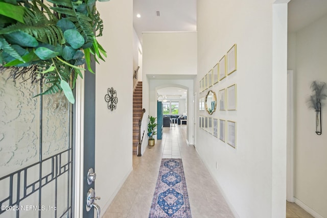 600 Broomsedge Cir, Saint Augustine, FL 32095 - corridor with arched walkways, a towering ceiling, and light tile patterned flooring