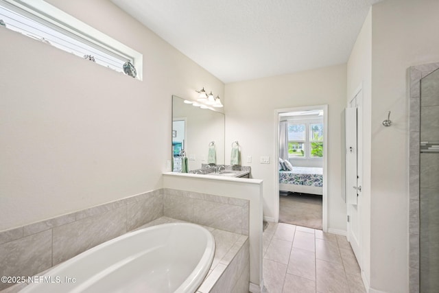 600 Broomsedge Cir, Saint Augustine, FL 32095 - full bathroom featuring a bath, connected bathroom, tiled shower, tile patterned flooring, and vanity