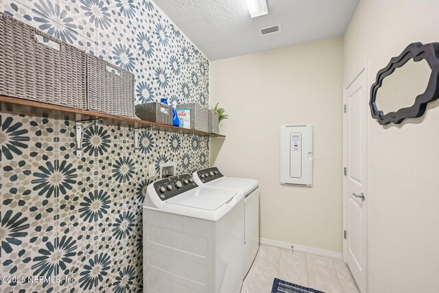 600 Broomsedge Cir, Saint Augustine, FL 32095 - washroom with washer and dryer, light tile patterned flooring, and a textured ceiling