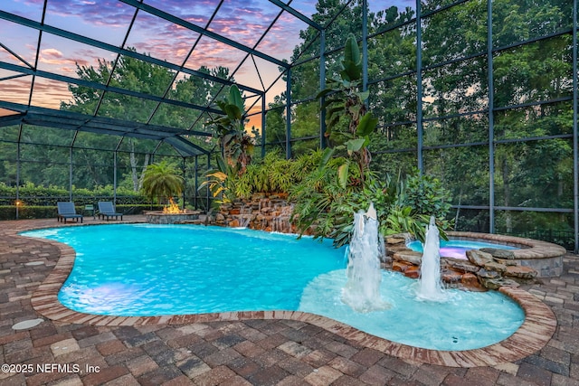 528 Sebastian Sq, Saint Augustine, FL 32095 - pool at dusk with an in-ground hot tub, an outdoor pool, a patio area, and glass enclosure