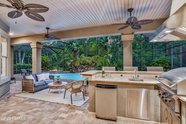 528 Sebastian Sq, Saint Augustine, FL 32095 - view of patio featuring ceiling fan, exterior kitchen, and glass enclosure