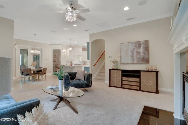 528 Sebastian Sq, Saint Augustine, FL 32095 - living room featuring a chandelier, stairway, a ceiling fan, recessed lighting, and arched walkways