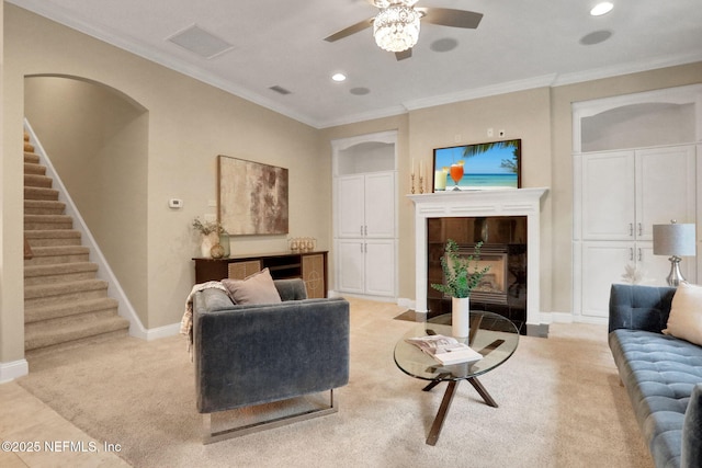 528 Sebastian Sq, Saint Augustine, FL 32095 - living room with a tile fireplace, stairs, ceiling fan, light colored carpet, and recessed lighting