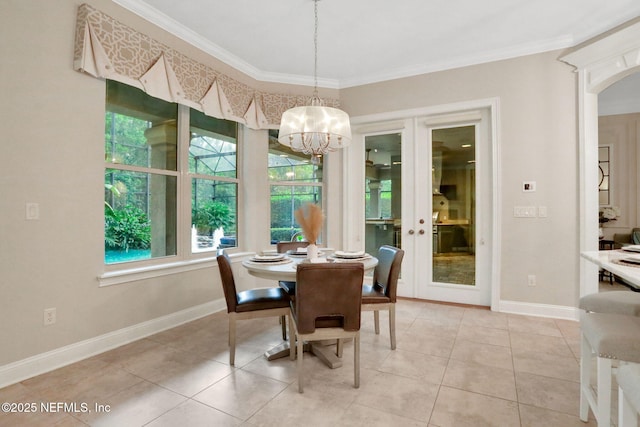 528 Sebastian Sq, Saint Augustine, FL 32095 - dining space featuring a chandelier, ornamental molding, light tile patterned floors, and arched walkways