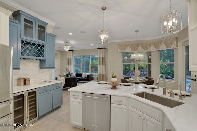 528 Sebastian Sq, Saint Augustine, FL 32095 - kitchen featuring a chandelier, appliances with stainless steel finishes, beverage cooler, backsplash, and recessed lighting