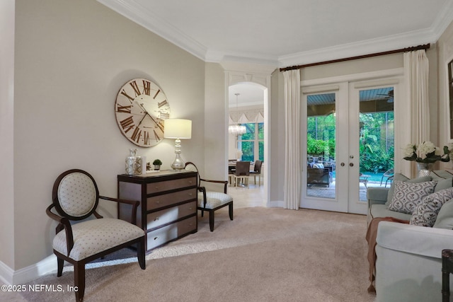 528 Sebastian Sq, Saint Augustine, FL 32095 - living area featuring french doors, crown molding, and light carpet