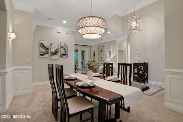 528 Sebastian Sq, Saint Augustine, FL 32095 - dining room with light colored carpet, a chandelier, crown molding, recessed lighting, and arched walkways