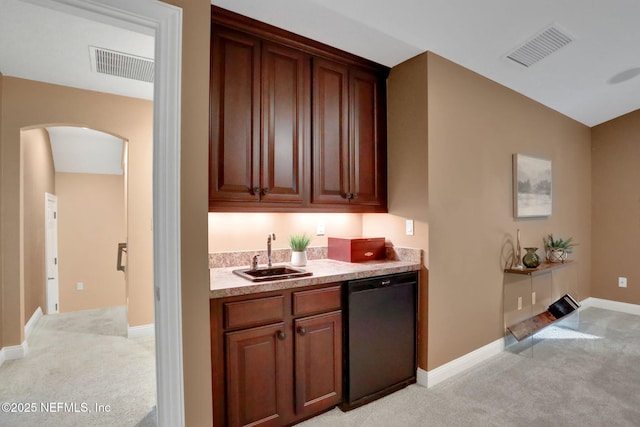 528 Sebastian Sq, Saint Augustine, FL 32095 - kitchen with dishwasher, light carpet, arched walkways, and light countertops