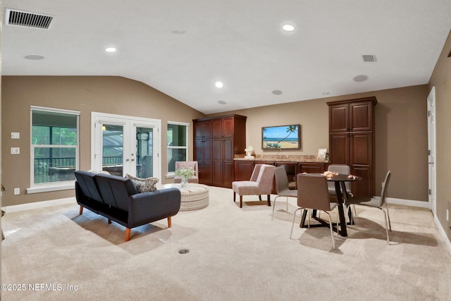 528 Sebastian Sq, Saint Augustine, FL 32095 - living room featuring french doors, light carpet, vaulted ceiling, and recessed lighting