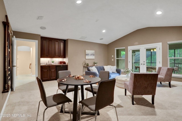 528 Sebastian Sq, Saint Augustine, FL 32095 - dining space with french doors, light colored carpet, lofted ceiling, and recessed lighting