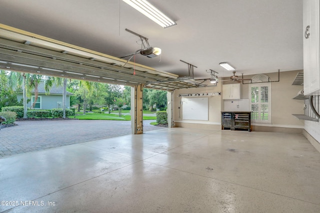 528 Sebastian Sq, Saint Augustine, FL 32095 - garage with a garage door opener and baseboards