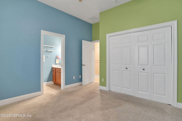 528 Sebastian Sq, Saint Augustine, FL 32095 - unfurnished bedroom featuring light carpet, a closet, and ensuite bath