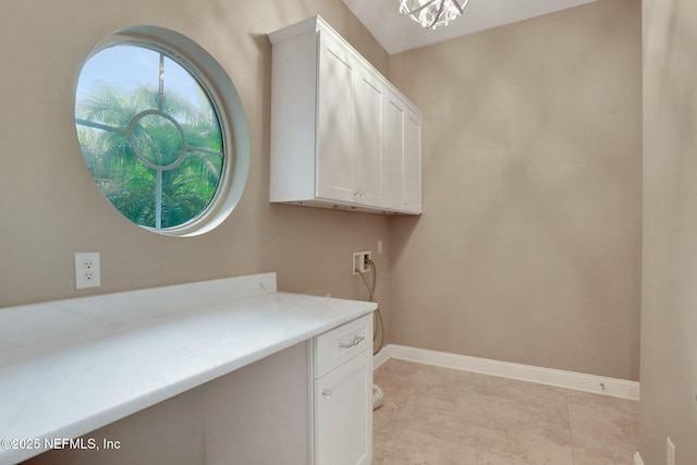 528 Sebastian Sq, Saint Augustine, FL 32095 - laundry room featuring cabinet space, washer hookup, and a chandelier