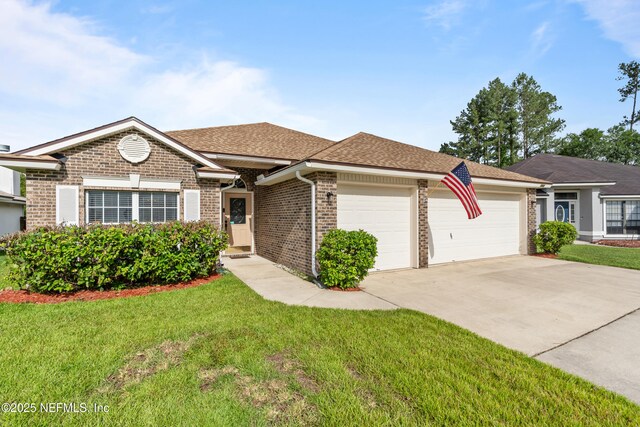 1861 Heartpine Dr, Middleburg, FL 32068 - ranch-style home with a garage, driveway, brick siding, a front yard, and roof with shingles