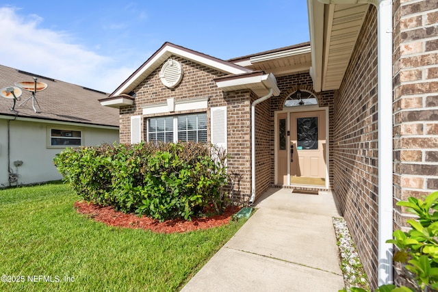 1861 Heartpine Dr, Middleburg, FL 32068 - view of exterior entry featuring brick siding and a lawn