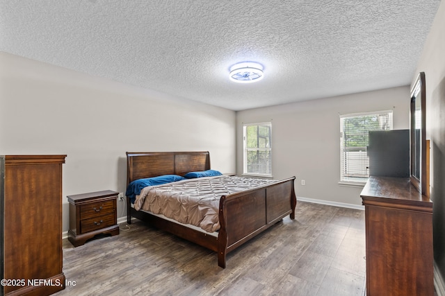 1861 Heartpine Dr, Middleburg, FL 32068 - bedroom with wood finished floors, a textured ceiling, and baseboards