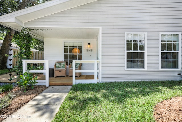 1848 Forsyth Ct, Atlantic Beach, FL 32233 - property entrance featuring a porch and a lawn