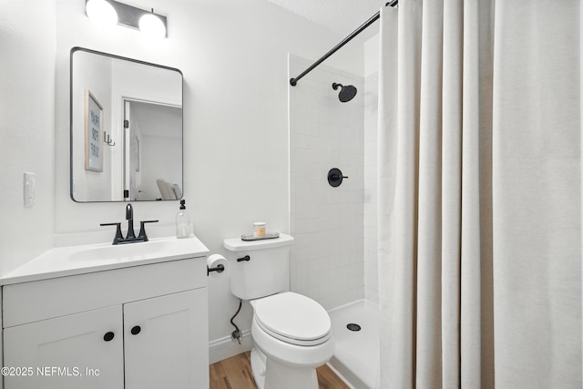1848 Forsyth Ct, Atlantic Beach, FL 32233 - bathroom with vanity, tiled shower, and wood finished floors