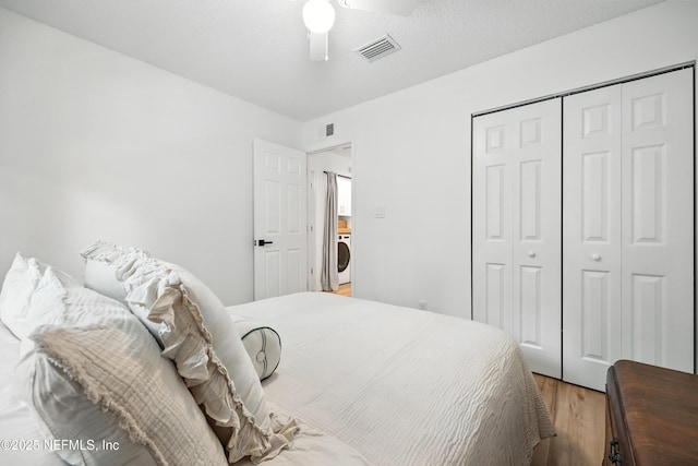 1848 Forsyth Ct, Atlantic Beach, FL 32233 - bedroom featuring light wood finished floors, a closet, ceiling fan, and washer / dryer