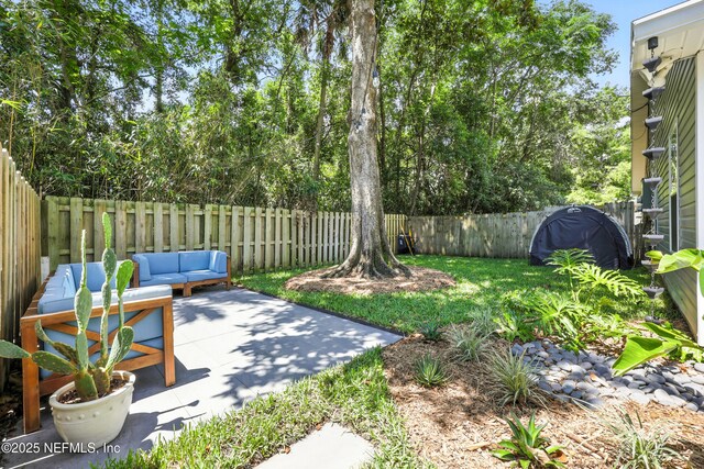 1848 Forsyth Ct, Atlantic Beach, FL 32233 - fenced backyard with a patio and an outdoor hangout area