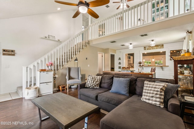 11461 Willet Ct S, Jacksonville, FL 32225 - living area featuring ceiling fan, a high ceiling, stairs, and wood finished floors