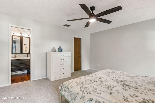 11461 Willet Ct S, Jacksonville, FL 32225 - bedroom featuring carpet flooring, ensuite bathroom, a textured ceiling, and a ceiling fan