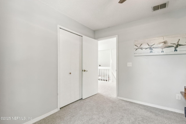 11461 Willet Ct S, Jacksonville, FL 32225 - unfurnished bedroom with carpet flooring, a closet, and a textured ceiling
