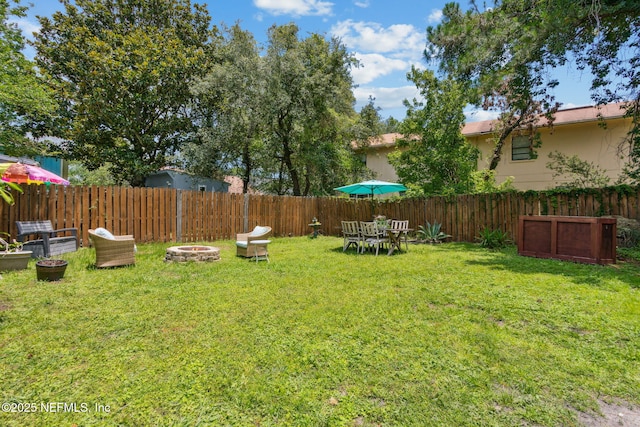 11461 Willet Ct S, Jacksonville, FL 32225 - fenced backyard featuring a fire pit
