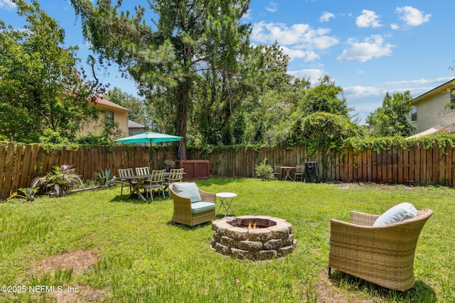 11461 Willet Ct S, Jacksonville, FL 32225 - fenced backyard featuring an outdoor fire pit