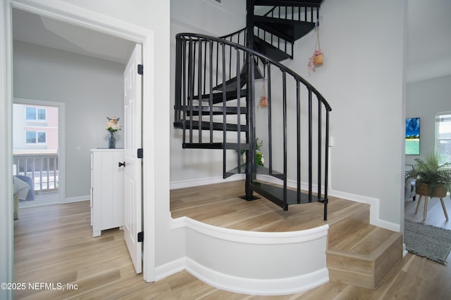 126 1st St S, Jacksonville Beach, FL 32250 - staircase featuring wood finished floors and baseboards