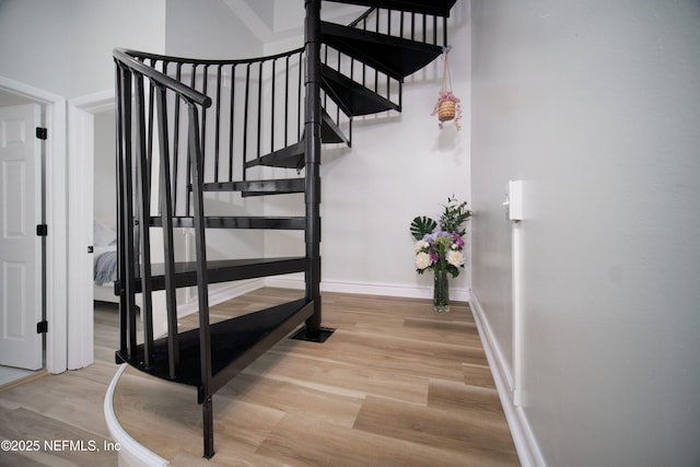 126 1st St S, Jacksonville Beach, FL 32250 - stairs with wood finished floors and baseboards