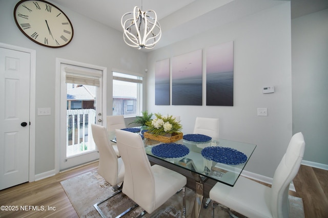 126 1st St S, Jacksonville Beach, FL 32250 - dining room featuring a chandelier, wood finished floors, and baseboards