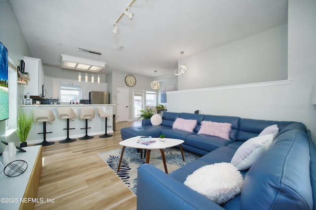 126 1st St S, Jacksonville Beach, FL 32250 - living area with light wood-style flooring and track lighting