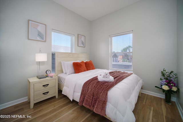 126 1st St S, Jacksonville Beach, FL 32250 - bedroom featuring multiple windows, wood finished floors, and baseboards