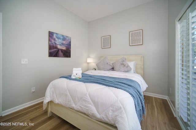 126 1st St S, Jacksonville Beach, FL 32250 - bedroom with wood finished floors and baseboards