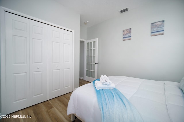 126 1st St S, Jacksonville Beach, FL 32250 - bedroom with wood finished floors and a closet