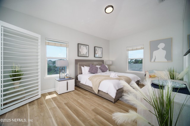 126 1st St S, Jacksonville Beach, FL 32250 - bedroom with light wood-style flooring