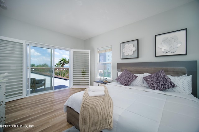 126 1st St S, Jacksonville Beach, FL 32250 - bedroom featuring access to exterior and wood finished floors