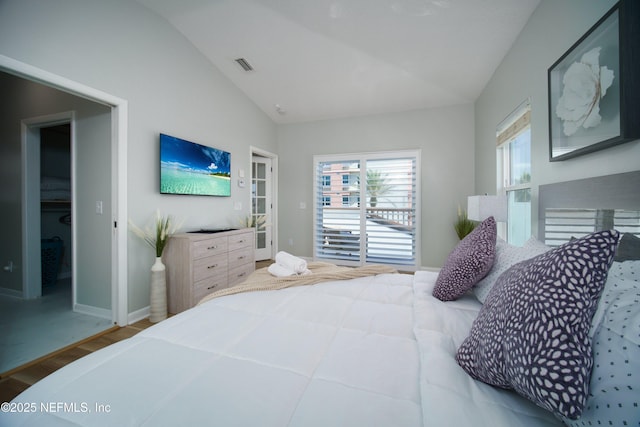 126 1st St S, Jacksonville Beach, FL 32250 - bedroom featuring lofted ceiling, wood finished floors, and baseboards