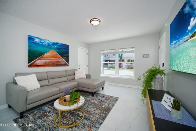 126 1st St S, Jacksonville Beach, FL 32250 - living area with marble look tile flooring and baseboards