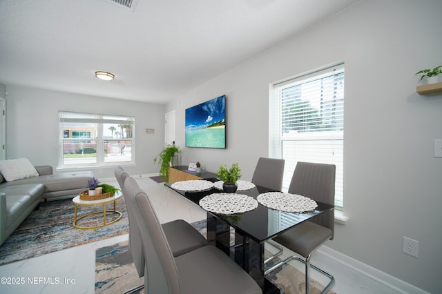 126 1st St S, Jacksonville Beach, FL 32250 - dining room with baseboards