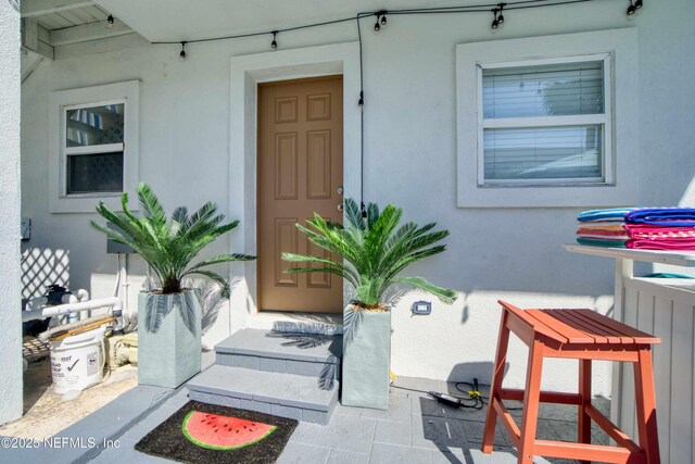 126 1st St S, Jacksonville Beach, FL 32250 - property entrance with stucco siding
