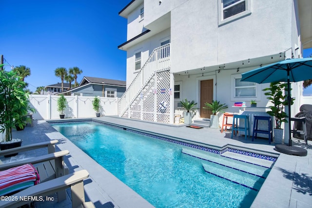 126 1st St S, Jacksonville Beach, FL 32250 - view of swimming pool featuring a patio area, a fenced backyard, and stairs
