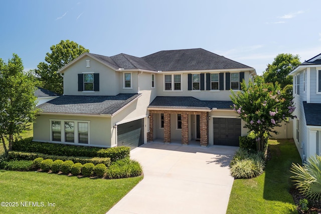 186 Citrus Ridge Dr, Ponte Vedra, FL 32081 - view of front of house with a garage, stucco siding, driveway, a front lawn, and roof with shingles